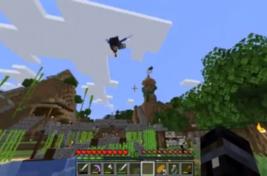 Player flying through the air using Elytra in Minecraft.